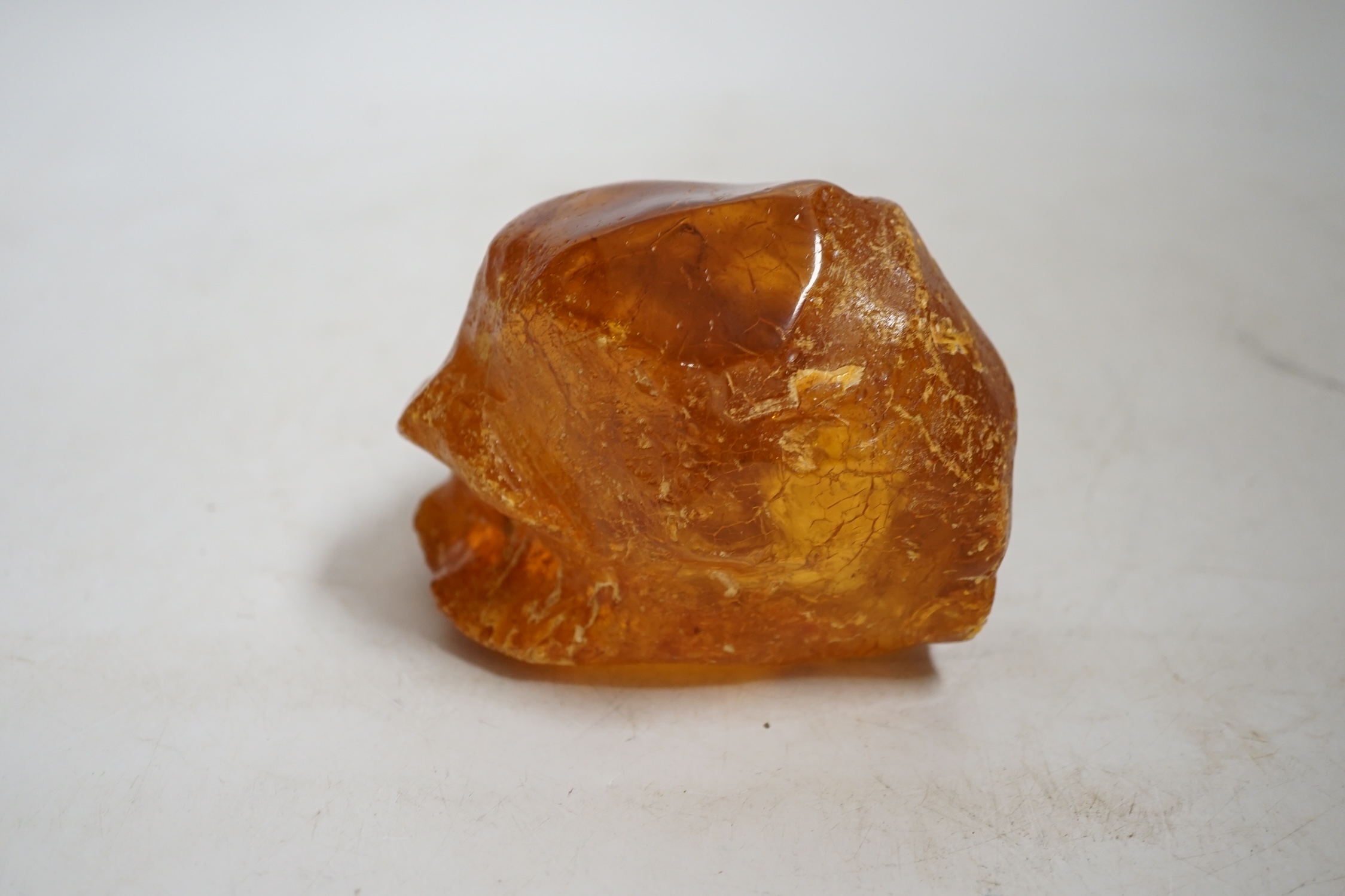A section of natural amber, approximately 11.5cm wide. Condition - fair